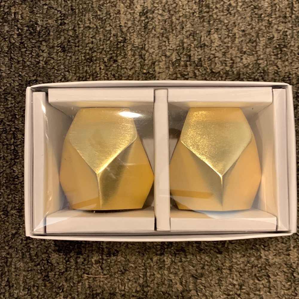 Gold salt and pepper shakers. From At Home.